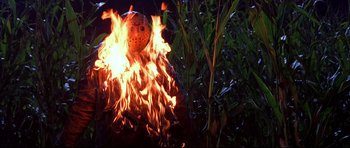 Movie still from “Freddy vs. Jason” (2003), directed by Ronny Yu – A mask is burning in the middle of the night; Medium shot, Low angle