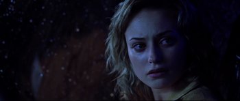 Movie still from “Freddy vs. Jason” (2003), directed by Ronny Yu – A person looking sad; Close Up shot, Over the shoulder angle