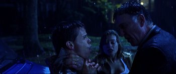 Movie still from “Freddy vs. Jason” (2003), directed by Ronny Yu – A group of people in the woods at night; Close Up shot, Low angle