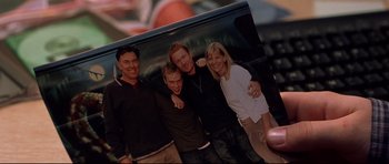 Movie still from “Freddy vs. Jason” (2003), directed by Ronny Yu – A picture of four people posing for a picture; Extreme Close Up shot, High angle