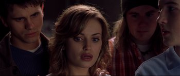 Movie still from “Freddy vs. Jason” (2003), directed by Ronny Yu – A person with long brown hair; Close Up shot, Over the shoulder angle