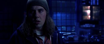 Movie still from “Freddy vs. Jason” (2003), directed by Ronny Yu – A man in a hat and jacket looking at the camera; Close Up shot, Over the shoulder angle