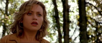 Movie still from “Freddy vs. Jason” (2003), directed by Ronny Yu – A person with a tree in the background; Close Up shot, Over the shoulder angle