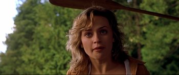 Movie still from “Freddy vs. Jason” (2003), directed by Ronny Yu – A person with long blonde hair; Close Up shot, Over the shoulder angle