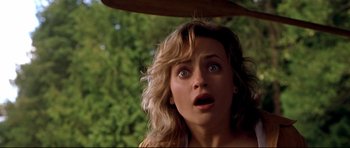 Movie still from “Freddy vs. Jason” (2003), directed by Ronny Yu – A person looking surprised with trees in the background; Close Up shot, Low angle