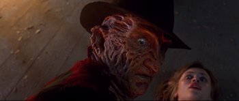 Movie still from “Freddy vs. Jason” (2003), directed by Ronny Yu – A person wearing a hat; Close Up shot, Low angle