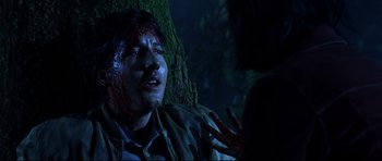 Movie still from “Freddy vs. Jason” (2003), directed by Ronny Yu – A man with blood all over his face and head; Close Up shot, Over the shoulder angle