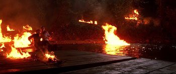 Movie still from “Freddy vs. Jason” (2003), directed by Ronny Yu – A fire is burning in the middle of the night; Extreme Wide shot, High angle