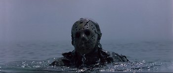 Movie still from “Freddy vs. Jason” (2003), directed by Ronny Yu – A man with a hockey mask is in the water; Medium shot, Low angle