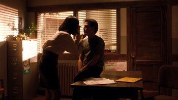 Movie still from “Freddy's Dead: The Final Nightmare” (1991), directed by Rachel Talalay – A man and a woman sitting at a table; Medium shot, Over the shoulder angle