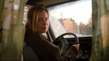Movie still from “Freddy's Dead: The Final Nightmare” (1991), directed by Rachel Talalay – A woman sitting in the driver's seat of a car; Close Up shot, Over the shoulder angle