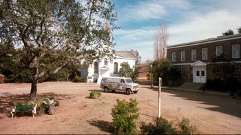 Movie still from “Freddy's Dead: The Final Nightmare” (1991), directed by Rachel Talalay – A van is parked in front of a church; Extreme Wide shot, High angle