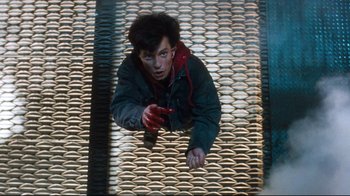 Movie still from “Freddy's Dead: The Final Nightmare” (1991), directed by Rachel Talalay – A man is holding a cell phone in his hand; Medium shot, Overhead angle