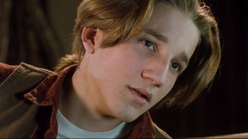 Movie still from “Freddy's Dead: The Final Nightmare” (1991), directed by Rachel Talalay – A person with long brown hair; Close Up shot, Low angle