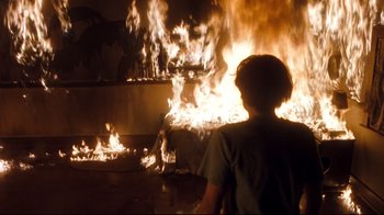 Movie still from “Freddy's Dead: The Final Nightmare” (1991), directed by Rachel Talalay – A man standing in front of a fire pit; Medium shot, High angle