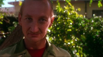 Movie still from “Freddy's Dead: The Final Nightmare” (1991), directed by Rachel Talalay – A person wearing a shirt; Close Up shot, Low angle