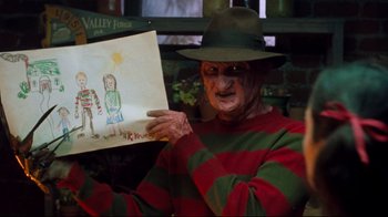 Movie still from “Freddy's Dead: The Final Nightmare” (1991), directed by Rachel Talalay – A man dressed as freddy krueger holding a drawing; Close Up shot, Low angle