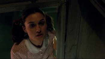 Movie still from “Freddy's Dead: The Final Nightmare” (1991), directed by Rachel Talalay – A young girl in a pink dress looking at the camera; Close Up shot, Low angle
