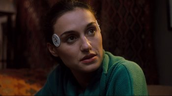 Movie still from “Freddy's Dead: The Final Nightmare” (1991), directed by Rachel Talalay – A person wearing a ear piece; Close Up shot, High angle