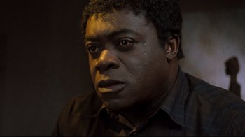 Movie still from “Freddy's Dead: The Final Nightmare” (1991), directed by Rachel Talalay – A person wearing a black shirt; Close Up shot, Low angle