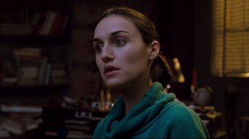 Movie still from “Freddy's Dead: The Final Nightmare” (1991), directed by Rachel Talalay – A person wearing a green sweater; Close Up shot, Over the shoulder angle