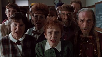 Movie still from “Freddy's Dead: The Final Nightmare” (1991), directed by Rachel Talalay – A group of people standing in a room; Medium shot, High angle