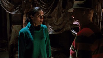 Movie still from “Freddy's Dead: The Final Nightmare” (1991), directed by Rachel Talalay – A woman in a green sweater and a man in a green jacket; Medium shot, Over the shoulder angle