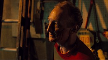 Movie still from “Freddy's Dead: The Final Nightmare” (1991), directed by Rachel Talalay – A man's face in a dark room; Close Up shot, Over the shoulder angle