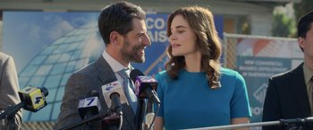 Movie still from “The Valet” (2022), directed by Richard Wong – A man and a woman standing next to each other; Medium shot, Over the shoulder angle