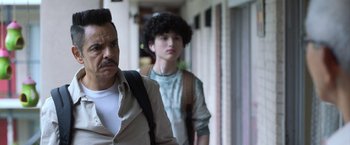 Movie still from “The Valet” (2022), directed by Richard Wong – A man and a woman walking down a hallway; Close Up shot, Over the shoulder angle