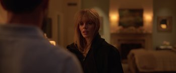 Movie still from “The Valet” (2022), directed by Richard Wong – A woman with long blonde hair wearing a black jacket; Close Up shot, Over the shoulder angle