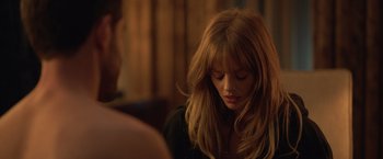 Movie still from “The Valet” (2022), directed by Richard Wong – A beautiful young woman with long , blonde hair and bangs; Close Up shot, Over the shoulder angle