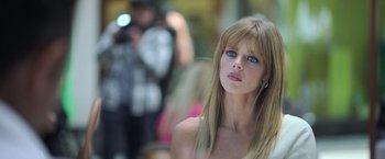 Movie still from “The Valet” (2022), directed by Richard Wong – A beautiful young woman with long blonde hair and blue eyes; Close Up shot, Low angle