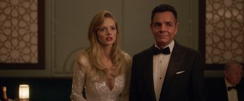 Movie still from “The Valet” (2022), directed by Richard Wong – A man and a woman standing next to each other; Medium shot, Low angle