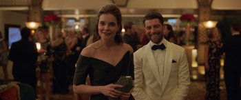 Movie still from “The Valet” (2022), directed by Richard Wong – A man and a woman in formal wear at an event; Medium shot, Over the shoulder angle