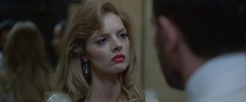 Movie still from “The Valet” (2022), directed by Richard Wong – A woman with red lipstick looking at a man in the mirror; Close Up shot, Over the shoulder angle