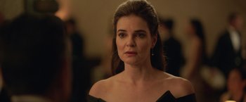 Movie still from “The Valet” (2022), directed by Richard Wong – A person wearing a dress; Close Up shot, Over the shoulder angle