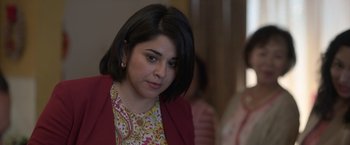 Movie still from “The Valet” (2022), directed by Richard Wong – A person wearing a jacket; Close Up shot, Over the shoulder angle