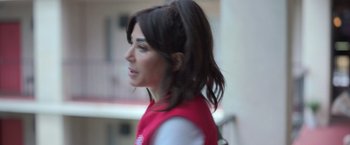 Movie still from “The Valet” (2022), directed by Richard Wong – A person with long hair; Close Up shot, Over the shoulder angle