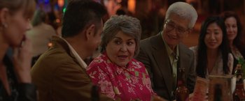 Movie still from “The Valet” (2022), directed by Richard Wong – An older woman is talking to two older men; Close Up shot, Over the shoulder angle