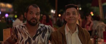 Movie still from “The Valet” (2022), directed by Richard Wong – A couple of men standing next to each other; Close Up shot, Over the shoulder angle