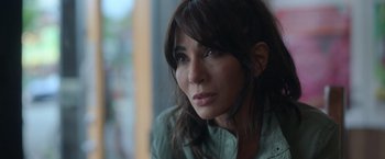 Movie still from “The Valet” (2022), directed by Richard Wong – A person looking at the camera; Close Up shot, Over the shoulder angle