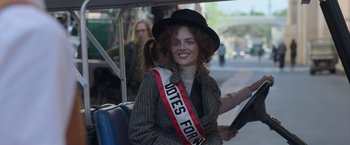 Movie still from “The Valet” (2022), directed by Richard Wong – A woman in a black hat sitting in a car; Close Up shot, Over the shoulder angle