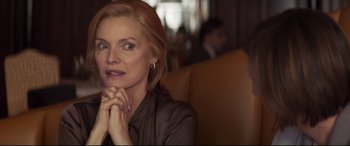 Movie still from “French Exit” (2020), directed by Azazel Jacobs – A person sitting in a chair; Close Up shot, Over the shoulder angle