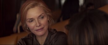 Movie still from “French Exit” (2020), directed by Azazel Jacobs – A person sitting in front of a camera; Close Up shot, Over the shoulder angle