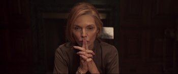 Movie still from “French Exit” (2020), directed by Azazel Jacobs – A woman with her finger to her mouth; Close Up shot, High angle