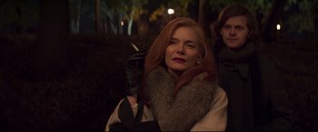 Movie still from “French Exit” (2020), directed by Azazel Jacobs – A woman with red hair and a cigarette in her hand; Close Up shot, Low angle