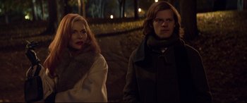 Movie still from “French Exit” (2020), directed by Azazel Jacobs – A man and a woman standing next to each other; Medium shot, Over the shoulder angle