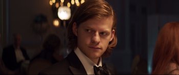 Movie still from “French Exit” (2020), directed by Azazel Jacobs – A person wearing a suit and bow tie; Close Up shot, Over the shoulder angle