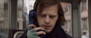 Movie still from “French Exit” (2020), directed by Azazel Jacobs – A man with long hair talking on a phone; Close Up shot, Low angle